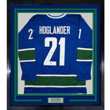 Framed Autographed/Signed Nils Hoglander 35x39 Vancouver Blue Hockey Jersey Beckett BAS COA